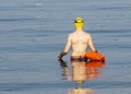 Swimmer entering the water outdoors