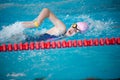 Swimmer girl swims freestyle swimming style in the pool Royalty Free Stock Photo