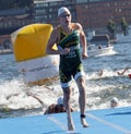 Swimmer Henri Schoeman (RSA) climbing up from the water Royalty Free Stock Photo