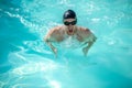 Swimmer with his head above water while breathing air