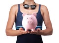 Swimmer holding a piggy bank Royalty Free Stock Photo