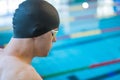 Swimmer jumping off the starting block Royalty Free Stock Photo