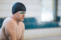 Swimmer jumping off the starting block Royalty Free Stock Photo