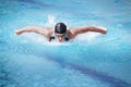 Swimmer performing the butterfly stroke,front Royalty Free Stock Photo