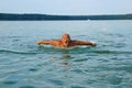 Swimmer, Senior man swimming butterfly strokes. Caucasian male aged 60 years Royalty Free Stock Photo