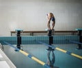 Swimmer standing on starting block Royalty Free Stock Photo