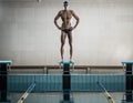 Swimmer standing on starting block Royalty Free Stock Photo