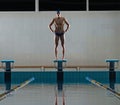 Swimmer standing on starting block Royalty Free Stock Photo