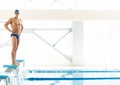 Swimmer standing on starting block Royalty Free Stock Photo