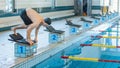 Swimmer taking a deep breath before jumping off the starting block Royalty Free Stock Photo