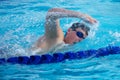 Swimmer Taking a Quick Breath Doing Freestyle