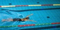 Swimmer using breaststroke drills during a swim training session Royalty Free Stock Photo