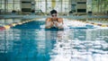 Swimmer using breaststroke drills during a swim training session Royalty Free Stock Photo