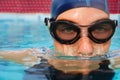 Swimmer woman submerging in pool