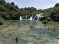 Swimmers in the crystal clear water of Krka river at Krka National Park Croatia.