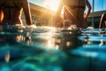 Swimmers at the edge of a pool with sunlight reflecting on water