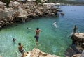 Swimmers enjoy jumping into the sea at the rock beach in Kas on the Turkish Mediterranean coast.