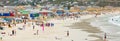 Swimmers frolicking in the shallow waves of Fish Hoek beach Royalty Free Stock Photo