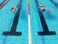 swimmers in lane pool, men in water Royalty Free Stock Photo