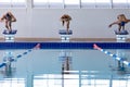 Swimmers plunging in the pool Royalty Free Stock Photo