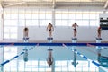 Swimmers ready to plunge Royalty Free Stock Photo