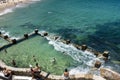 Swimmers and sunbathers enjoying the warm summer weather