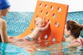 Swimming class with instructor for infants Royalty Free Stock Photo