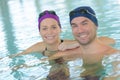 Swimming couple in swimming pool Royalty Free Stock Photo