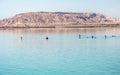 Swimming in the Dead Sea near the mountain of Sodom.