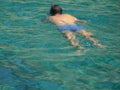 Swimming diving in milos island in greece, kleftiko bay rock caves, sea swimming sailing in summer holidays Royalty Free Stock Photo