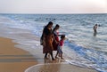 Swimming and fun on the sandy Marari beach near city Kochi, Ker