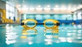 Swimming goggles in the pool with copy space