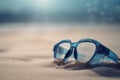 Swimming goggles on sand beach. Generate ai Royalty Free Stock Photo