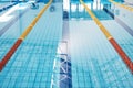 Swimming, lane and water at an indoor pool for sports, recreation and weekend fun. Empty, training and a rows for Royalty Free Stock Photo