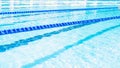Swimming lanes with clear blue water in public swimming pool in summer Royalty Free Stock Photo
