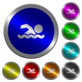 Swimming man luminous coin-like round color buttons Royalty Free Stock Photo