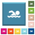 Swimming man white icons on edged square buttons Royalty Free Stock Photo