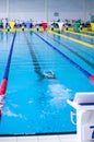 Swimming person in comptetition diving under water