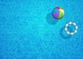 Swimming pool background with beach ball and rubber ring Royalty Free Stock Photo