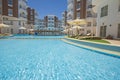 Swimming pool with bar in a luxury tropical hotel apartment resort Royalty Free Stock Photo