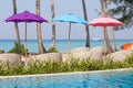 Swimming pool and beach chairs near the sea, Thailand Royalty Free Stock Photo