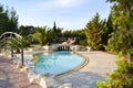 Swimming pool with a beautiful bridge in a modern luxury villa, Greece. Travel and recreation. Royalty Free Stock Photo