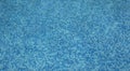 Swimming Pool in a Beautiful Garden. Magnificent Mosaic in Blue Transparent Water at the Bottom of the Pool. The Texture of the