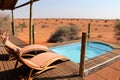 Swimming pool with beautiful view over the Kalahari desert - Namibia Africa Royalty Free Stock Photo