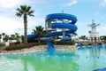 Swimming pool and blue spiral water slide in a hotel, Turkey Royalty Free Stock Photo