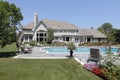 Swimming pool with blue stone deck Royalty Free Stock Photo