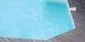 Swimming pool with blue water detail and movement detection alarm aside Royalty Free Stock Photo