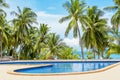 Swimming pool blue water, sea beach poolside, tropical island nature, green palm trees, ocean coast, summer holidays, vacation Royalty Free Stock Photo