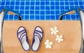 Swimming pool blue water, white plumeria frangipani flowers, women flip flops, poolside, tropical sea beach nature, summer holiday Royalty Free Stock Photo