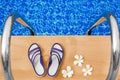 Swimming pool blue water, white plumeria frangipani flowers, women flip flops, poolside, tropical sea beach nature, summer holiday Royalty Free Stock Photo